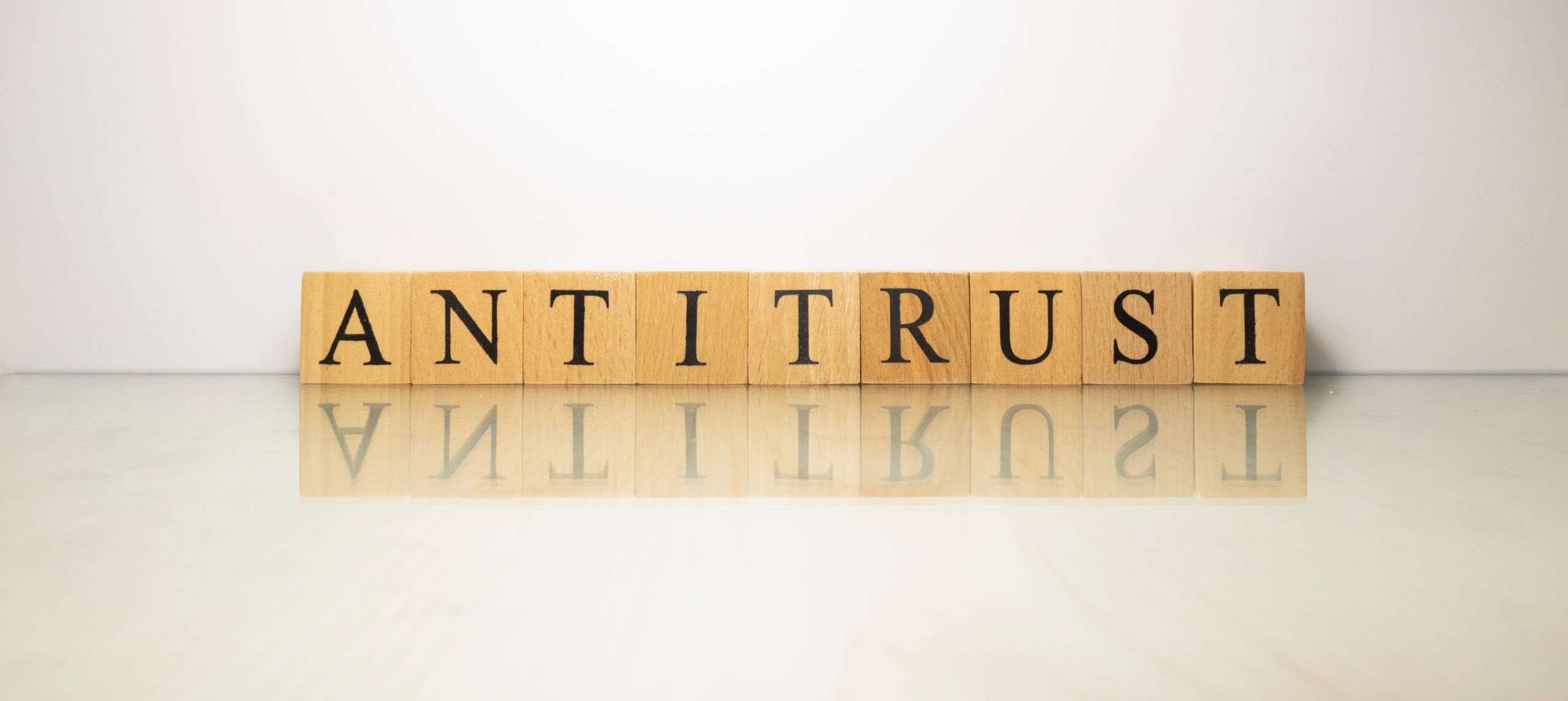The,Name,Antitrust,Was,Created,From,Wooden,Letter,Cubes.,Finance